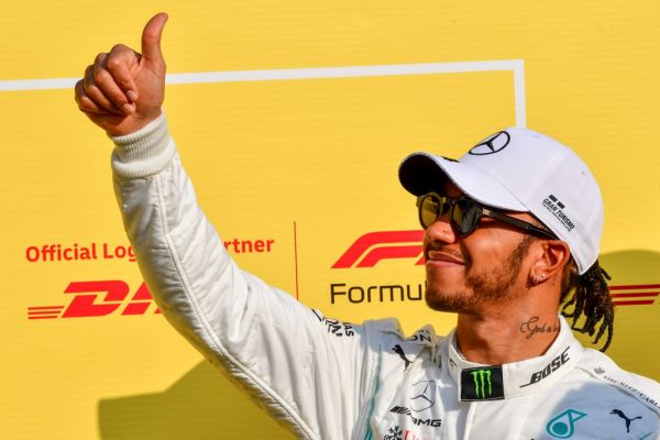 Mercedes' British driver Lewis Hamilton gives the thumbs up at the Yas Marina Circuit in Abu Dhabi, ahead of the final race of the season, on December 1, 2019. PHOTO \ AFP