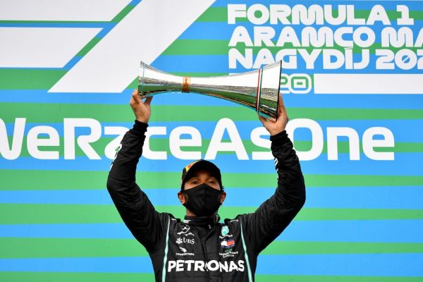 Mercedes' British driver Lewis Hamilton lifts the winning trophy after the Formula One Hungarian Grand Prix race at the Hungaroring circuit in Mogyorod near Budapest, Hungary, on July 19, 2020. PHOTO | AFP