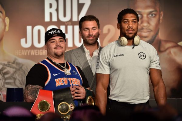 Mexican-American heavyweight boxing champion Andy Ruiz Jr (L) Eddie Hearn (C) and British heavyweight boxing challenger Anthony Joshua (R) are pictured during their press conference in Diriyah in the Saudi capital Riyadh, on December 4, 2019, ahead of the upcoming "Clash on the Dunes". The hotly-anticipated rematch between Ruiz Jr and British challenger Anthony Joshua is scheduled to take place in Diriya, near the Saudi capital on December 7. PHOTO | AFP