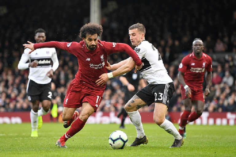 Mohamed Salah of Liverpool battles for possession with Joe Bryan of Fulham during the Premier League match between Fulham FC and Liverpool FC at Craven Cottage on March 17, 2019 in London, United Kingdom. PHOTO/ GETTY IMAGES
