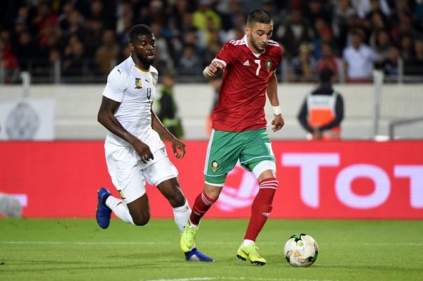 Morocco's midfielder Hakim Ziyech (R) is marked by Cameroon's defender Jerome Onguene during the Africa Cup of Nations qualifier football match between Morocco and Cameroon at the Mohamed V Stadium in Casablanca. PHOTO/AFP