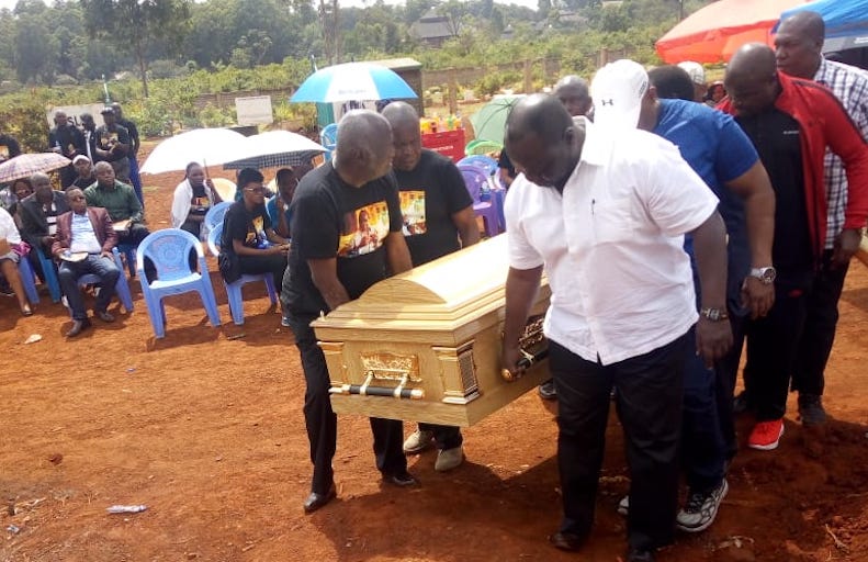 Mourners led by Reuben Ndolo (right) carry the casket of legendary Kenyan boxer, Dick 'Tiger' Murunga during his funeral last week. PHOTO/Courtesy 