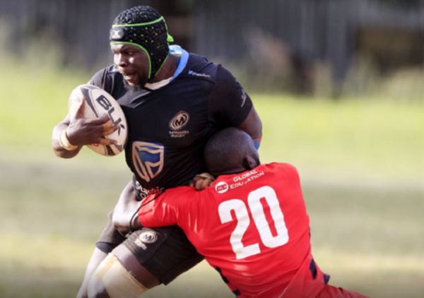 Mwamba RFC’s Edwin Machanje is tackled by Impala Saracen’s Davies Makori during their Kenya Cup match. Photo/RAYMOND MAKHAYA