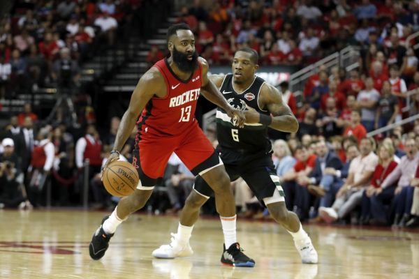 n this file photo James Harden #13 of the Houston Rockets dribbles the ball defended by Eric Bledsoe #6 of the Milwaukee Bucks in the second half at Toyota Center on October 24, 2019 in Houston, Texas. James Harden erupted for a fourth quarter scoring spree as the Houston Rockets defeated the Los Angeles Clippers 102-93 on Wednesday. PHOTO | AFP