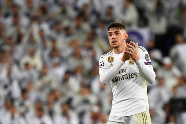 n this file photo taken on November 26, 2019 Real Madrid's Uruguayan midfielder Federico Valverde applauds during the UEFA Champions League group A football match Real Madrid against Paris Saint-Germain FC at the Santiago Bernabeu stadium in Madrid. Zinedine Zidane pursued Paul Pogba but found Fede Valverde and his emergence as Real Madrid's most important midfielder may yet prove the turning point in their season. Signed for six million euros in 2016, Valverde cost around 200 million less than Madrid might have paid for Pogba last summer. As well as saving the club money, he might have saved their coach too. PHOTO \ AFP