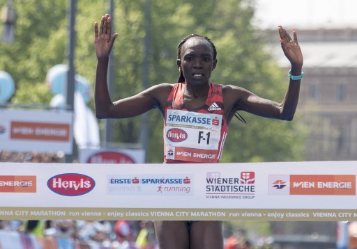 Nancy Kiprop of Kenya reacts as she crosses the finish line as the first the women during the Vienna City Marathon in Vienna, Austria, on April 22, 2018. More than 41000 athletes take part in the 35th Vienna City Marathon. PHOTO/AFP