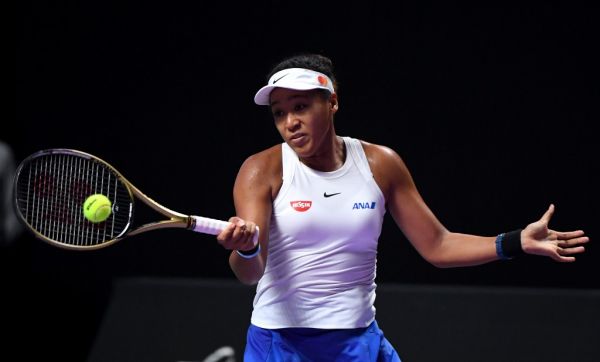 Naomi Osaka of Japan hits a return against Petra Kvitova of Czech Republic during their women's singles first round match in the WTA Finals tennis tournament in Shenzhen on October 27, 2019. PHOTO | AFP