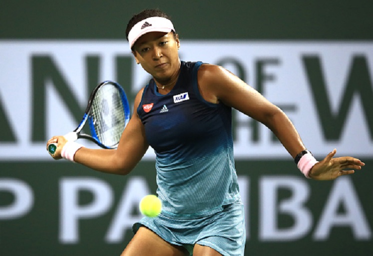 Naomi Osaka of Japan plays a forehand against Belinda Bencic of Switzerland during their women's singles fourth round match on day nine of the BNP Paribas Open at the Indian Wells Tennis Garden on March 12, 2019 in Indian Wells, California. PHOTO/GettyImages