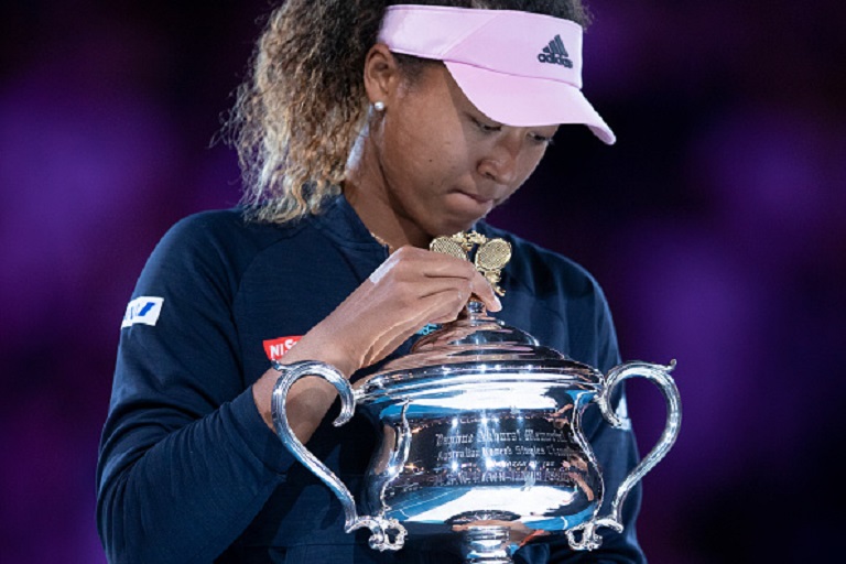 Naomi Osaka of Japan poses for a photo with the Daphne Akhurst Memorial Cup following victory in her Women's Singles Final match against Petra Kvitova of the Czech Republic during day 13 of the 2019 Australian Open at Melbourne Park on January 26, 2019 in Melbourne, Australia.PHOTO/GETTY IMAGES