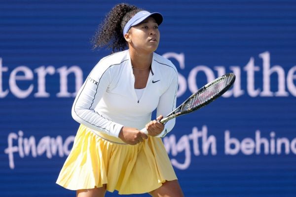 Naomi Osaka of Japan returns a shot to Shuai Zhang of China during the Western & Southern Open at Lindner Family Tennis Center on August 16, 2022 in Mason, Ohio. PHOTO | AFP