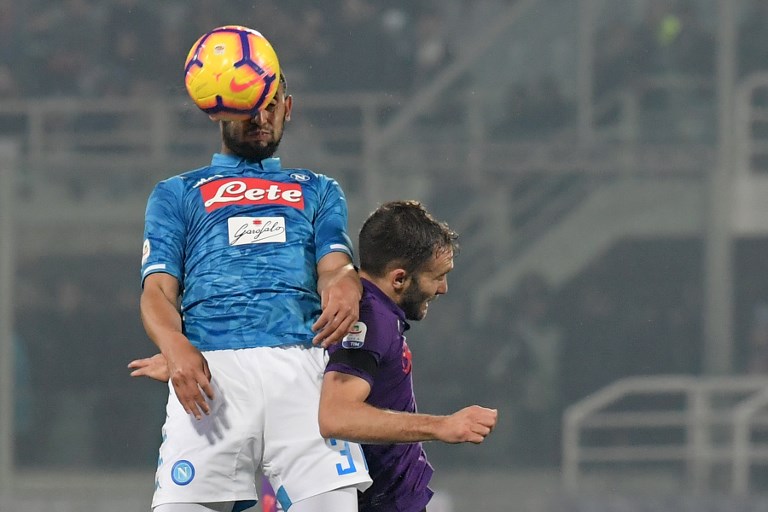 Napoli's Algerian defender Faouzi Ghoulam (L) and Fiorentina's Argentine defender German Pezzella go for a header during the Italian Serie A football match Fiorentina vs Napoli on February 9, 2019 at the Artemio-Franchi stadium in Florence. PHOTO/AFP