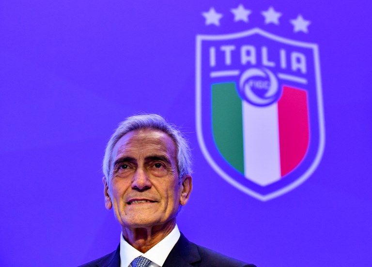New President of the Italian Football Federation (FIGC), Gabriele Gravina poses with the federation's logo following the vote during the elective assembly of the FIGC on October 22, 2018 at the Hilton hotel of Rome's Fiumicino airport. PHOTO/AFP