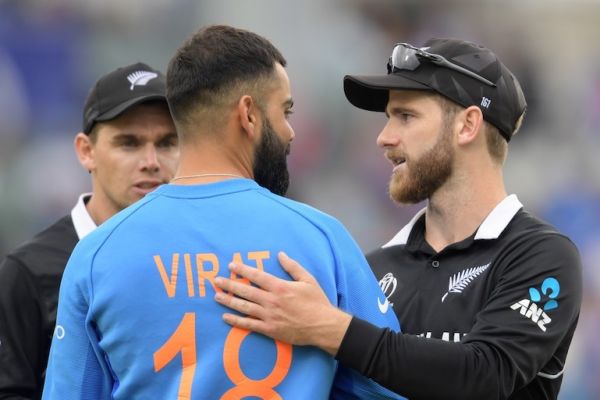 New Zealand's captain Kane Williamson (R) greets India's captain Virat Kohli at the end of play during the 2019 Cricket World Cup first semi-final between New Zealand and India at Old Trafford in Manchester, northwest England, on July 10, 2019. New Zealand beat India by 18 runs. PHOTO/AFP