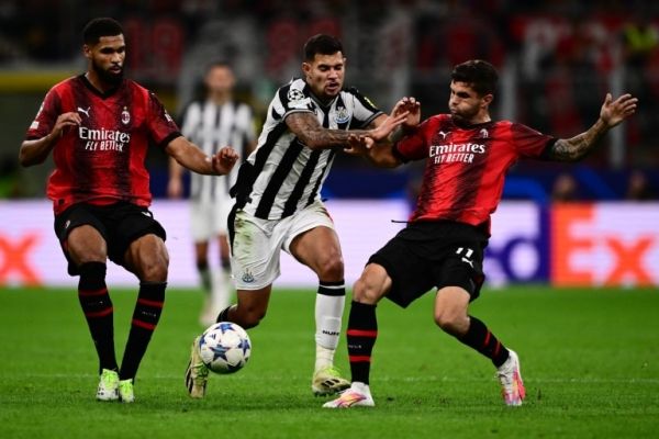 Newcastle's Bruno Guimaraes taking on Milan's Christian Pulisic and Ruben Loftus Cheek. PHOTO| AFP