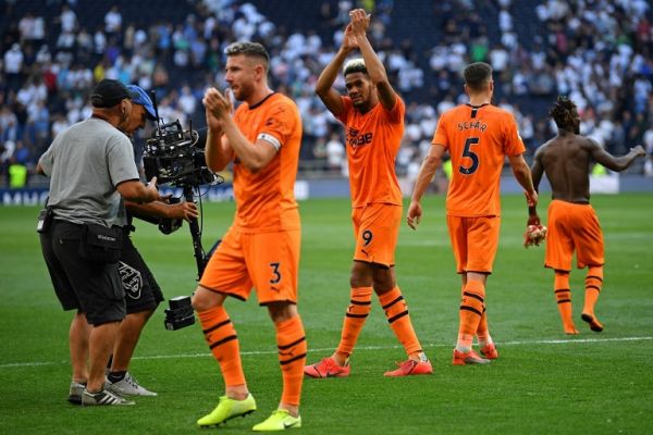 Newcastle United's Brazilian striker Joelinton (C) applauds supporters as Newcastle players celebrate on the final whistle in the English Premier League football match between Tottenham Hotspur and Newcastle United at Tottenham Hotspur Stadium in London, on August 25, 2019. Newcastle won the game 1-0. PHOTO | AFP