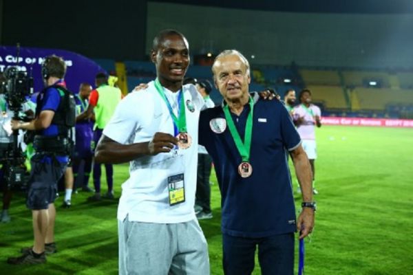 Nigeria's coach Gernot Rohr and Odion Ighalo celebrates after receiving a medal for winning the 2019 Africa Cup of Nations third place between Tunisia and Nigeria at the Al-Salam Stadium in Cairo, Egypt, on 17 July 2019. PHOTO/ AFP