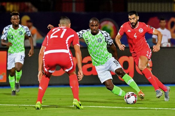 Nigeria's forward Odion Ighalo (2nd-R) dribbles past Tunisia's defender Nassim Hnid during the 2019 Africa Cup of Nations (CAN) third place play-off football match between Tunisia and Nigeria at the Al Salam stadium in Cairo on July 17, 2019. PHOTO | AFP