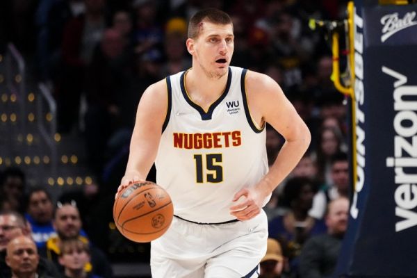 Nikola Jokic #15 of the Denver Nuggets dribbles up the court while bleeding against the Memphis Grizzlies at Ball Arena on April 7, 2022 in Denver, Colorado. PHOTO | AFP