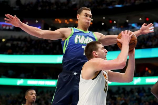 Nikola Jokic #15 of the Denver Nuggets drives to the basket against Dwight Powell #7 of the Dallas Mavericks in the second half at American Airlines Center on January 08, 2020 in Dallas, Texas. PHOTO | AFP