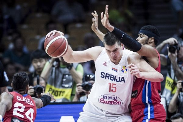 Nikola Jokic of Serbia, left, keeps the ball during the second round against Puerto Rico at FIBA Basketball World Cup in Wuhan city, central China’s Hubei province, 6 September 2019. Serbia defeats Puerto Rico with 90-47 during the second round of FIBA Basketball World Cup in Wuhan city, central China’s Hubei province, 6 September 2019. PHOTO | AFP