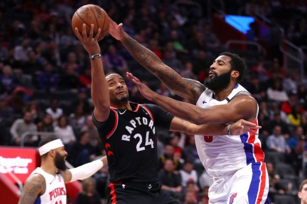 Norman Powell #24 of the Toronto Raptors takes a shot past Andre Drummond #0 of the Detroit Pistons during the second half at Little Caesars Arena on January 31, 2020 in Detroit, Michigan. Toronto won the game 105-92. PHOTO | AFP