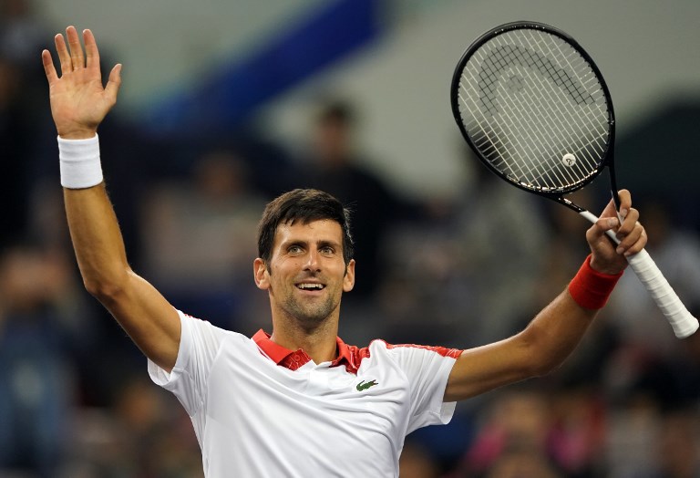 Novak Djokovic of Serbia celebrates after defeating Jeremy Chardy of France during their men's singles first round match at the Shanghai Masters tennis tournament on October 9, 2018. PHOTO/AFP