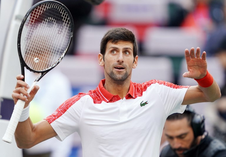 Novak Djokovic of Serbia celebrates after defeating Marco Cecchinato of Italy in their men's singles third round match at the Shanghai Masters tennis tournament on October 11, 2018. PHOTO/AFP