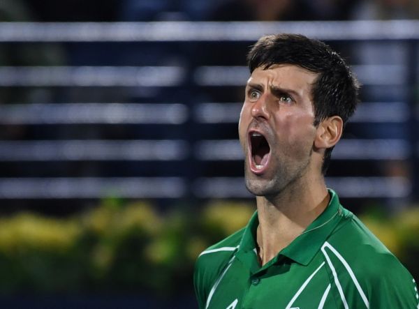 Novak Djokovic of Serbia celebrates after winning the final of the Dubai Duty Free Tennis Championship in the Gulf emirate of Dubai on February 29, 2020. PHOTO | AFP