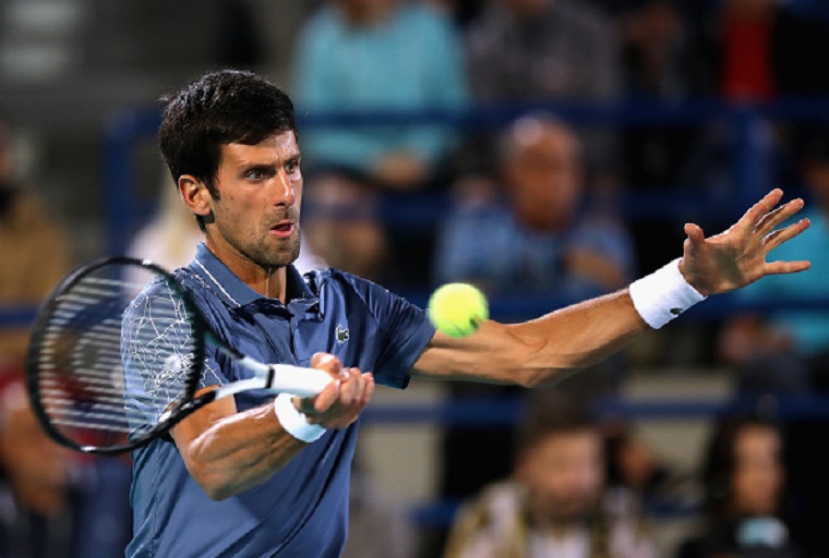 Novak Djokovic of Serbia hits a backhand against Federico Delbonis of Argentina in the third round of the men's singles in the Miami Open at the Hard Rock Stadium on March 24, 2019 in Miami Gardens, Florida. PHOTO/GettyImages