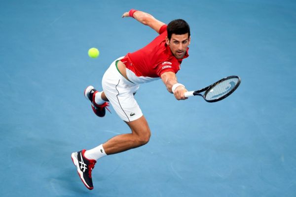 Novak Djokovic of Serbia hits a return in his men's singles match against Denis Shapovalov of Canada at the ATP Cup tennis tournament in Sydney on January 10, 2020. PHOTO | AFP