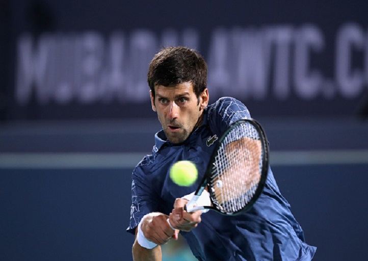 Novak Djokovic of Serbia in action against Kevin Anderson of South Africa during the men's final match of the Mubadala World Tennis Championship at International Tennis Centre Zayed Sports City on December 29, 2018 in Abu Dhabi, United Arab Emirates. PHOTO/GettyImages