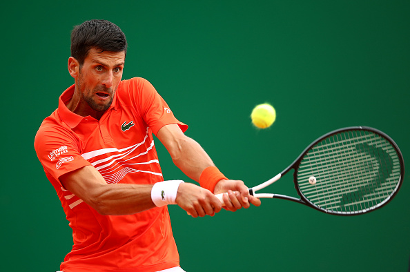 Novak Djokovic of Serbia plays a backhand against Philipp Kohlschreiber of Germany in their second round match during day 3 of the Rolex Monte-Carlo Masters at Monte-Carlo Country Club on April 16, 2019 in Monte-Carlo, Monaco.PHOTO/GETTY IMAGES