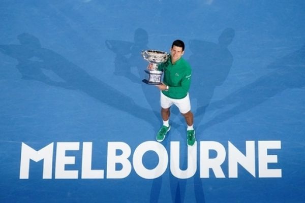 Novak Djokovic of Serbia poses for a photograph with the Norman Brookes Challenge Cup following the men's singles final on day 14 of the Australian Open tennis tournament at Rod Laver Arena in Melbourne, Sunday, February 2, 2020. PHOTO | PA Images