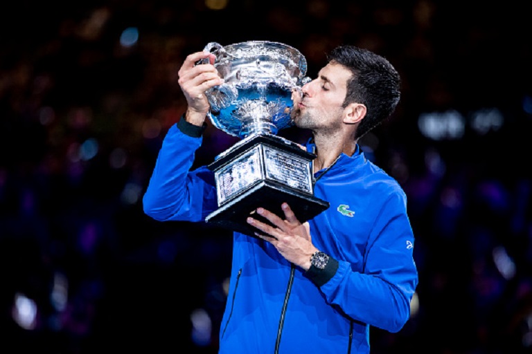 Novak Djokovic of Serbia poses with the Norman Brookes Challenge Cup following victory in his Men's Singles Final match against Rafael Nadal of Spain during day 14 of the 2019 Australian Open at Melbourne Park on January 27, 2019 in Melbourne, Australia. PHOTO/GETTY IMAGES