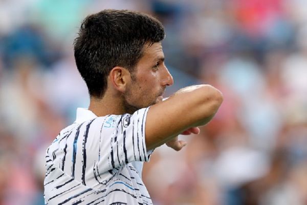 Novak Djokovic of Serbia wipes his face between points against Daniil Medvedev of Russia during the Western & Southern Open at Lindner Family Tennis Center on August 17, 2019 in Mason, Ohio. PHOTO/ GETTY IMAGES