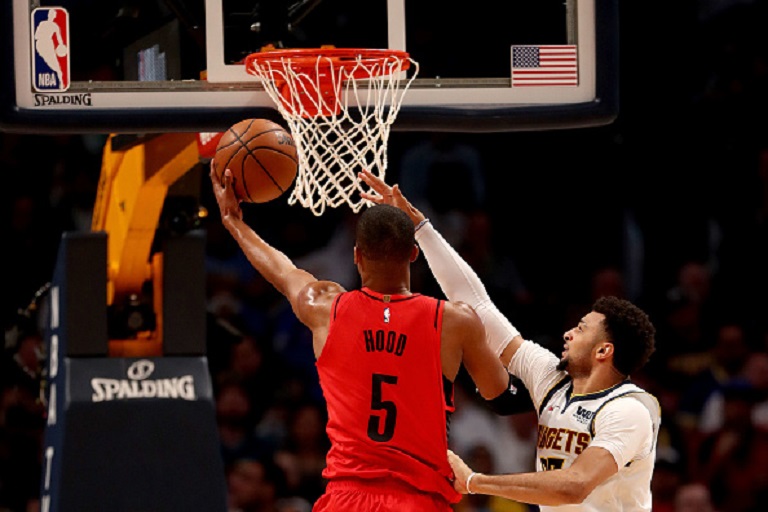 odney Hood #5 of the Portland Trail Blazers goes to the basket against Jamal Murray #27 of the Denver Nuggets in the second quarter during Game Two of the Western Conference Semi-Finals of the 2019 NBA Playoffs at the Pepsi Center on May 1, 2019 in Denver, Colorado. PHOTO/GETTY IMAGES