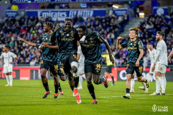 Okumu celebrates with teammates after scoring. PHOTO| Stade de Reims