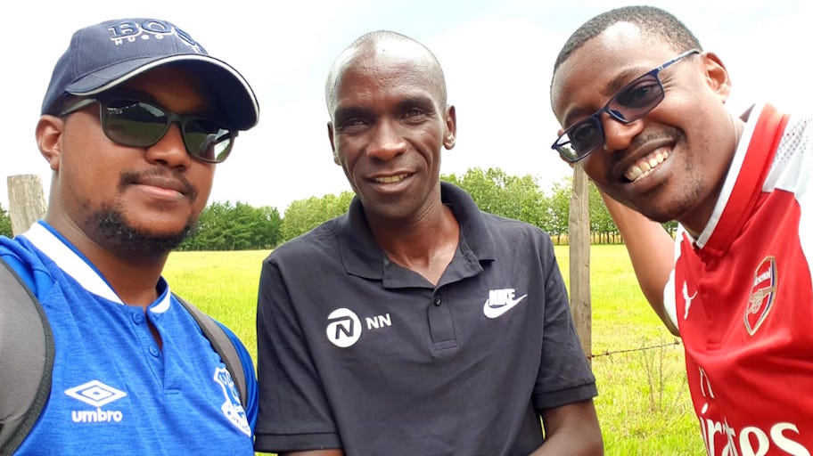 Olympic champion and world marathon record holder, Eliud Kipchoge (centre) flanked by SportPesa News Head of Digital, Farid Kipirash (left) and Senior Content Editor, Mutwiri Mutuota, during the visit of the pioneering A Day In Life feature segment at Eldoret on Tuesday, October 9, 2018. PHOTO/SPN