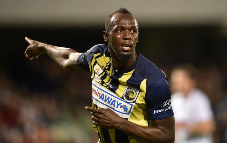 Olympic sprinter Usain Bolt (C) celebrates scoring for A-League football club Central Coast Mariners against Macarthur South West United in his first competitive start for the club in Sydney on October 12, 2018. PHOTO/AFP