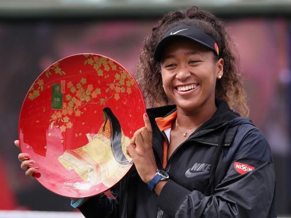 Pan Pacific Open women's singles winner Naomi Osaka holds a victory plate during the awarding ceremony in Osaka on September 22, 2019. PHOTO | AFP