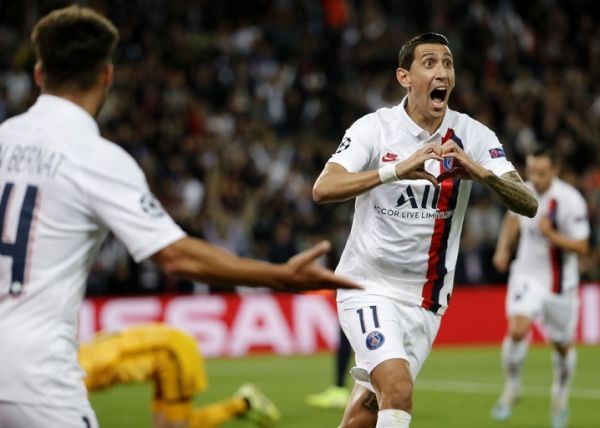 Paris Saint-Germain's Argentine midfielder Angel Di Maria celebrates scoring his team's first goal during the UEFA Champions league Group A football match between Paris Saint-Germain and Real Madrid, at the Parc des Princes stadium, in Paris, on September 18, 2019. PHOTO | AFP