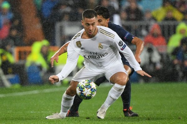 Paris Saint-Germain's Brazilian defender Marquinhos (R) challenges Real Madrid's Belgian forward Eden Hazard during the UEFA Champions League group A football match against Paris Saint-Germain FC at the Santiago Bernabeu stadium in Madrid on November 26, 2019. PHOTO | AFP