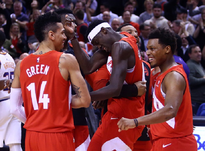 Pascal Siakam #43 of the Toronto Raptors celebrates with teammates after sinking the winning basket following the second half of an NBA game against the Phoenix Suns at Scotiabank Arena on January 17, 2019 in Toronto, Canada. PHOTO/GettyImages