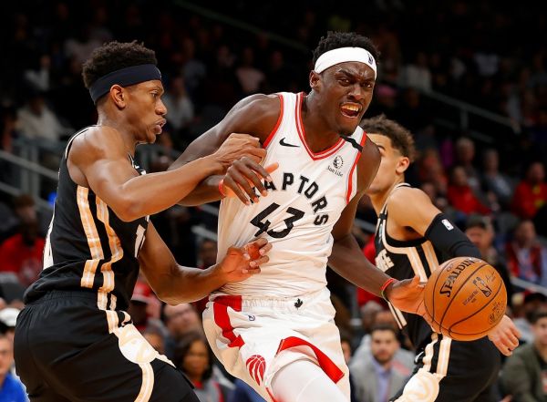 Pascal Siakam #43 of the Toronto Raptors drives against De'Andre Hunter #12 of the Atlanta Hawks in the first half at State Farm Arena on January 20, 2020 in Atlanta, Georgia. PHOTO | AFP