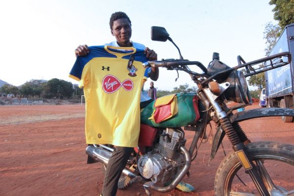 Patrick ‘Abu Dhabi’ Dulu, 25, with his Southampton FC jersey he received during Kits For Africa initiative at Moi Stadium in Voi on July 25, 2019. PHOTO/ SPN
