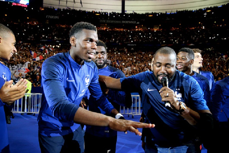 Paul Pogba of France and Magic System music group dance with the FIFA World Cup won on July 15, 2018 in Moscow-Russia in front of their fans after the UEFA Nations League A group one match between France and Netherlands at Stade de France on September 9, 2018 in Paris, FranceP HOTO/GETTY IMAGES