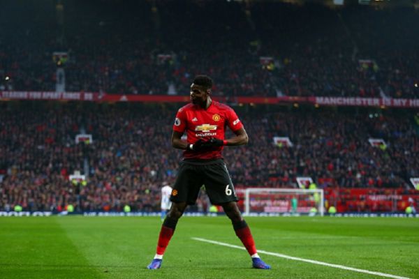 Paul Pogba of Manchester United celebrates after scoring a goal to make it 1-0 during the Premier League match between Manchester United and Brighton & Hove Albion at Old Trafford on January 19, 2019 in Manchester, United Kingdom.PHOTO/GETTY IMAGES