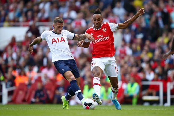 Pierre-Emerick Aubameyang of Arsenal challenges for the ball with Toby Alderweireld of Tottenham Hotspur during the Premier League match between Arsenal FC and Tottenham Hotspur at Emirates Stadium on September 01, 2019 in London, United Kingdom. PHOTO/ GETTY IMAGES