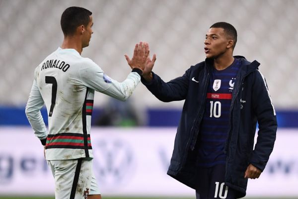 Portugal's forward Ronaldo (L) greets France's forward Kylian Mbappe at the end of the Nations League football match between France and Portugal, on October 11, 2020 at the Stade de France in Saint-Denis, outside Paris. PHOTO | AFP