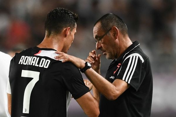 Portuguese football player Cristiano Ronaldo, left, of Juventus F.C. talks to his coach Maurizio Sarri as they compete against Inter Milan during the 2019 International Champions Cup football tournament in Nanjing city, east China's Jiangsu province, 24 July 2019. PHOTO | AFP